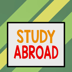 Text sign showing Study Abroad. Business photo text live in a foreign country and attend a foreign university Front close up view big blank rectangle abstract geometrical background