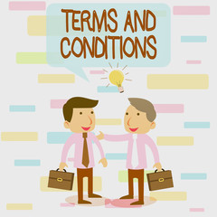 Writing note showing Terms And Conditions. Business concept for rules that apply to fulfilling a particular contract Two White Businessmen Colleagues with Brief Cases Sharing Idea Solution