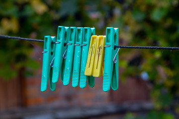 Old clothespins on a thread