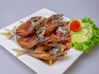 Thai food fried fish in white plate