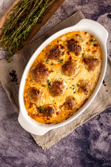 Meatballs baked in a thick sauce.