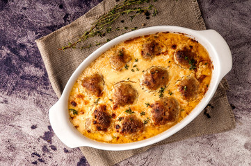 Meatballs baked in a thick sauce.