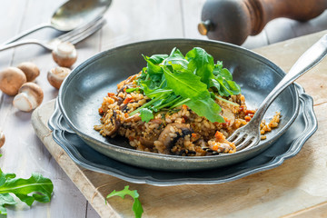 Mushroom, chorizo and thyme risotto with rocket lettuce