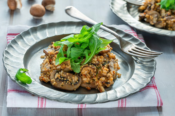Mushroom, chorizo and thyme risotto with rocket lettuce