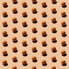 Creative pattern of eggs on a beige background.