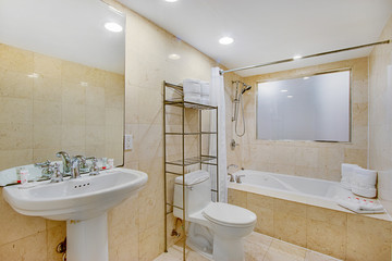 modern spacious white bathroom with marble interior