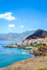 Picturesque Marina da Quinta Grande in Portuguese island Madeira. Small village, harbor located by Ponta de Sao Lourenco. Rocks and hills behind the city by the Atlantic ocean. Cities. Travel spot