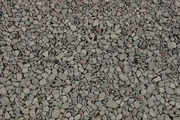 background from a pile of small stones of gray rubble