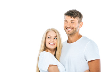 happy man and woman in white t-shirts smiling isolated on white