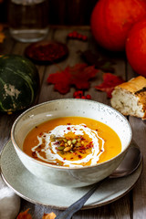 Pumpkin soup on a wooden background. Healthy eating.