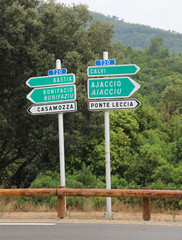 road in corsica called T20 with road sign with arrow and the tex