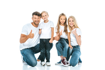 Obraz premium happy parents and kids showing thumbs up on white