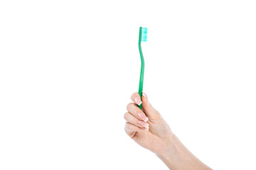 cropped view of woman holding green toothbrush isolated on white