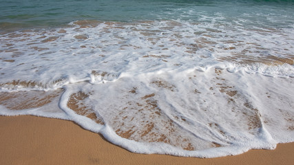 Frothy waves washing the pristine beach Playa Jandia, in Fuerteventura, one of the most attractive tourist destinations in the Canary Islands, for its white sandy beaches, mild climate and wild nature