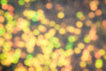 Abstraction christmas golden lights. Background of bright glow bokeh.