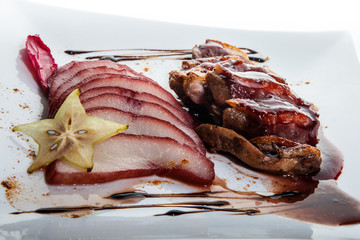 closeup exquisite restaurant dish of sliced roasted duck breast