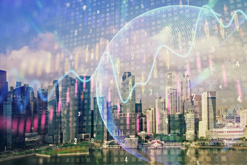Obraz premium Forex chart on cityscape with skyscrapers wallpaper multi exposure. Financial research concept.
