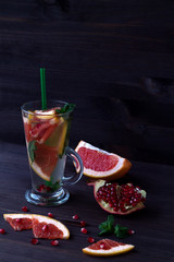 healthy eating. fresh red cocktail with ripe grapefruit and pomegranate. detox water. diet healthy eating and weight loss concept, copy space for text