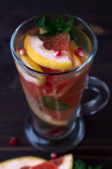 natural foods. fresh red cocktail with ripe grapefruit and orange. detox water. diet healthy eating and weight loss concept.