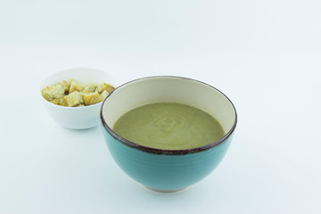 Cream of lentil and zucchini soup with chicken and parsley