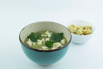 Cream of lentil and zucchini soup with chicken and parsley