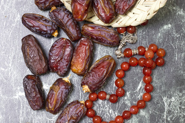 Dates on Arabian bowl, selective focus / Ramadan food