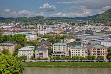 Beautiful view of Salzach river and the garden in Schloßpark Mirabell in Salzburg with Barockmuseum and church St. Andrä, Austria