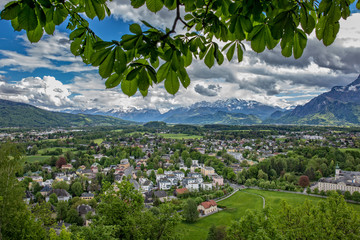 Beautiful view from the fortress Hohensalzburg to the south side of Salzburg, showing the Nonntal  and the mountains of Hallein and Berchtesgaden in Austria and Germany