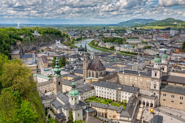 Fototapeta premium Beautiful view of the old town with the Dom zu Salzburg, the Franziskanerkirche, the Kapitelplatz and the Stift St. Peter Salzburg, Austria
