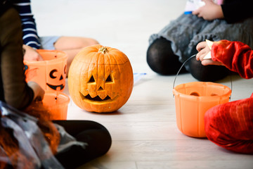 Cheerful Cute children in costumes ready for trick-or-treating Halloween holiday concept