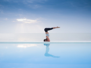 Asian woman practice yoga on the beach