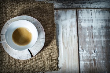 cup of coffee on wooden background with copy space for text