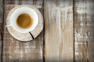 cup of coffee on wooden table