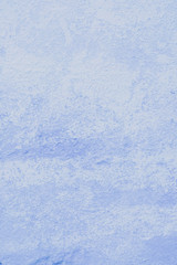 Wall painted in light blue as texture and background for design.  