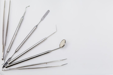 Stiril dental tools on white background in dental clinic. Stomatology, medical, healthcare, oral care concept