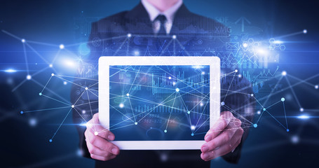 Elegant hand holding tablet with virtual database and network concept