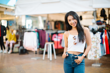 Pretty smiling woman walking on the street