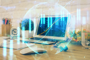 Double exposure of forex chart and work space with computer. Concept of international online trading.