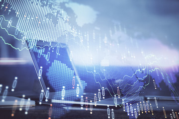 Forex market chart hologram and personal computer background. Double exposure. Concept of investment.