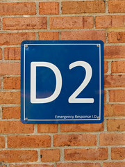 Obraz premium Vertical, portrait view of an Emergency Response ID sign. Signs are placed on the outside of buildings to help first responders locate certain parts of buildings in a timely manner during an emergency