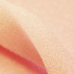 White pink artificial foam, soft texture on a light background.