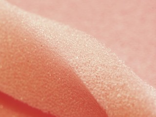 White pink artificial foam, soft texture on a light background.