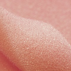 White pink artificial foam, soft texture on a light background.