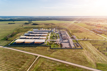 Agricultural plant in the middle of boundless agricultural land. A modern enterprise for the...
