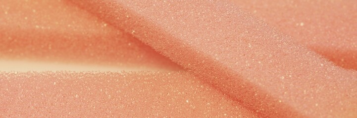 White pink artificial foam, soft texture on a light background.