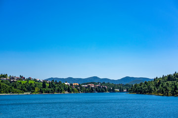 Fototapeta na wymiar Panoramic view of town of Fuzine on Lake Bajer, Gorski kotar, Croatia on sunny summer day