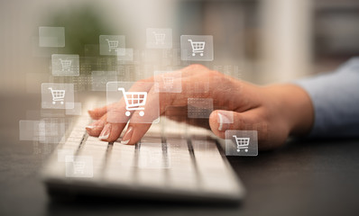 Business woman hand typing on keyboard with online shopping concept
