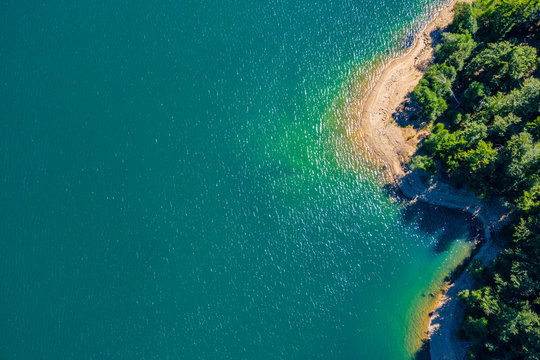 - Aerial panoramic view of Lokvarsko Lake, beautiful mountain landscape on sunny summer day, Lokve, Gorski kotar, Croatia