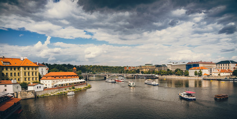 Obraz premium Scenic panorama cityscape view of Moldava river boat Prague in Czech Republic.