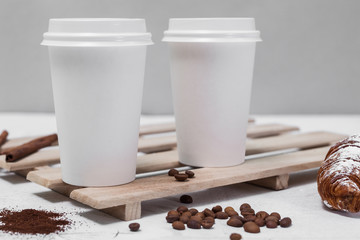Two coffee cup mock-up on table